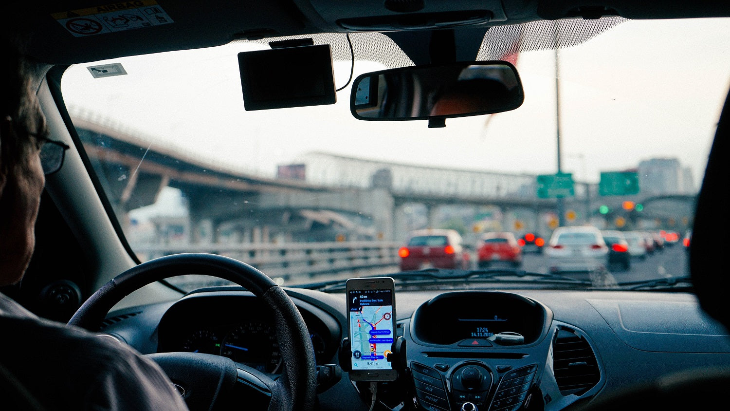man driving car